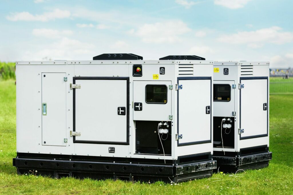 Set two large portable industrial power fuel generator green lawn at commercial event outdoors clear